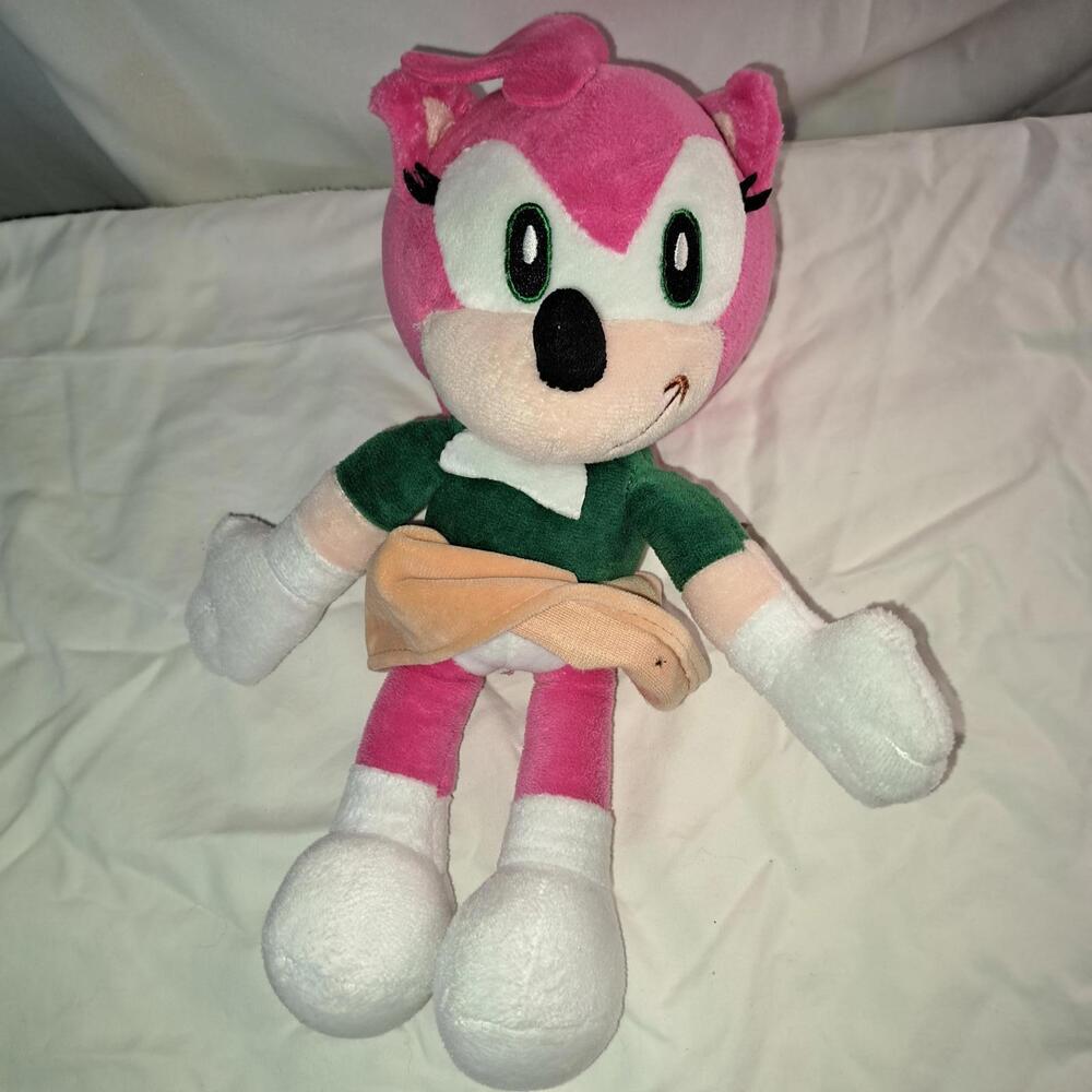 Pink Plush Character Doll with Green Top and Peach Skirt